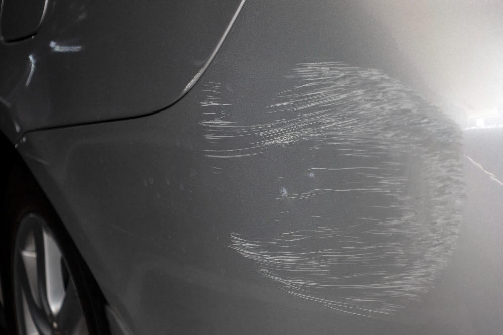 grey car with scratch accident