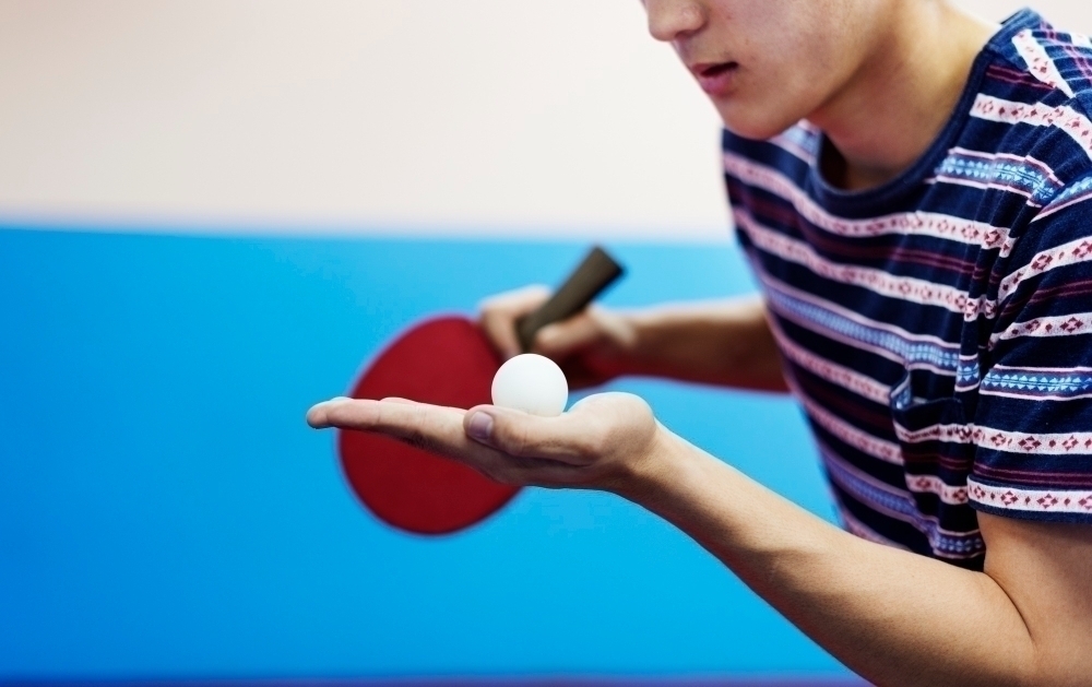 Asian guy playing table tennis