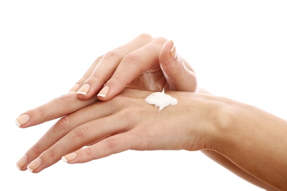 Beautiful hands with hand cream