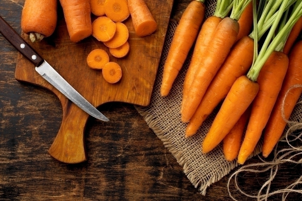 Bunch of fresh carrots with vitamin A arrangement