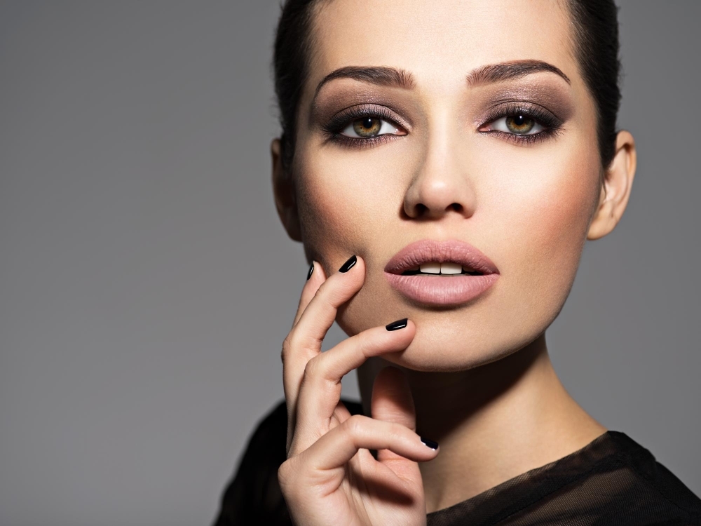 Face of a beautiful girl with fashion makeup