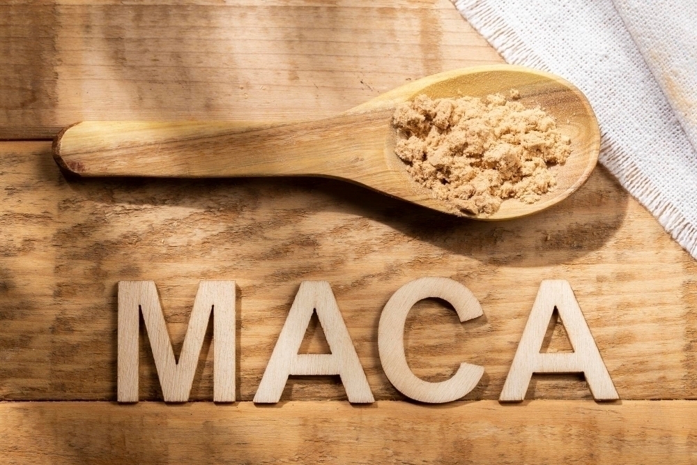 Maca powder in wooden bowl on the table nutritional substance