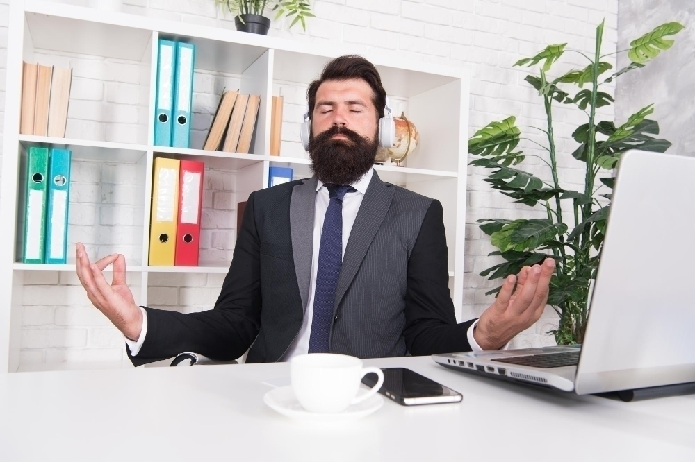 Man at office managing stress