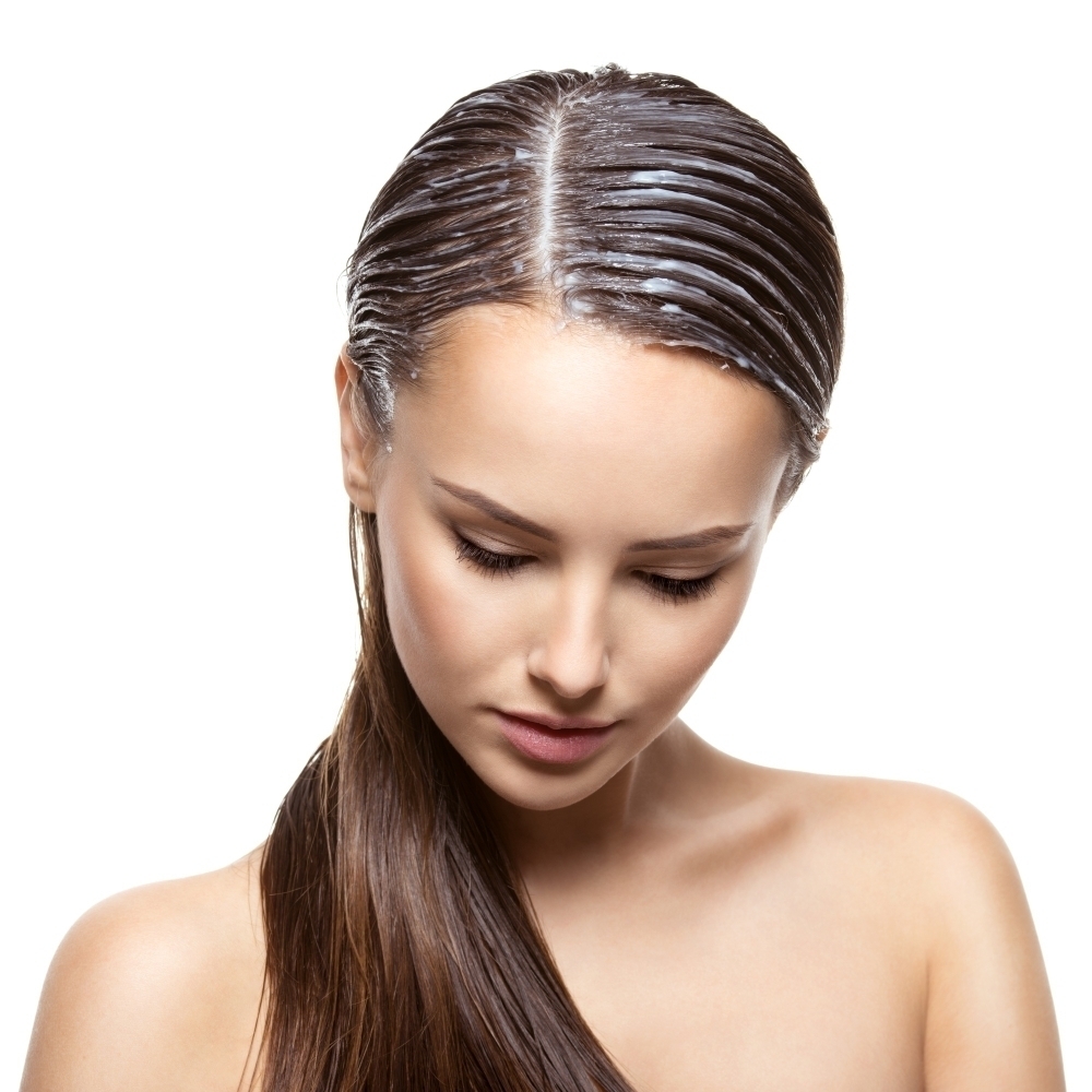 portrait girl with applied paint hairs white wall