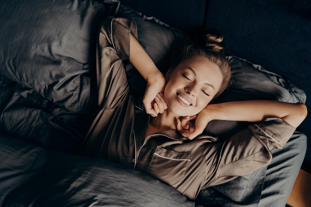 young woman waking up after a good nights sleep