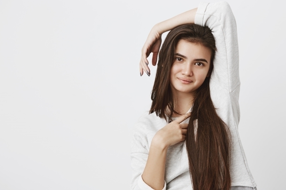 young woman with healthy hair skin and nails